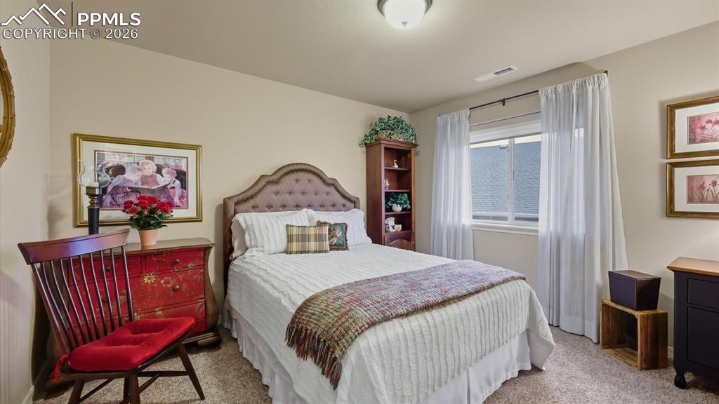 Upper Level Bedroom #2 with neutral carpet.