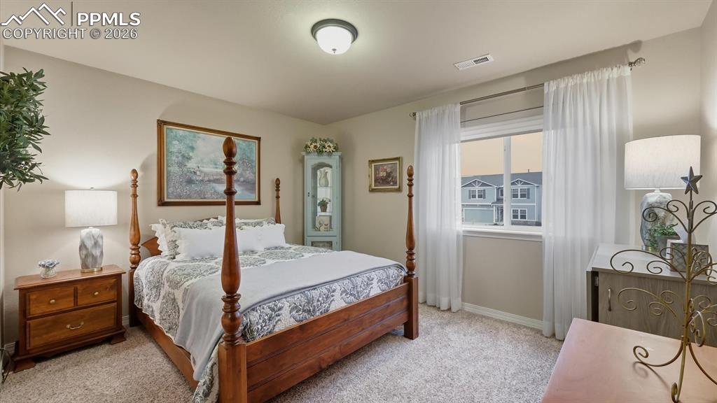Upper Level Bedroom #3 with neutral carpet.