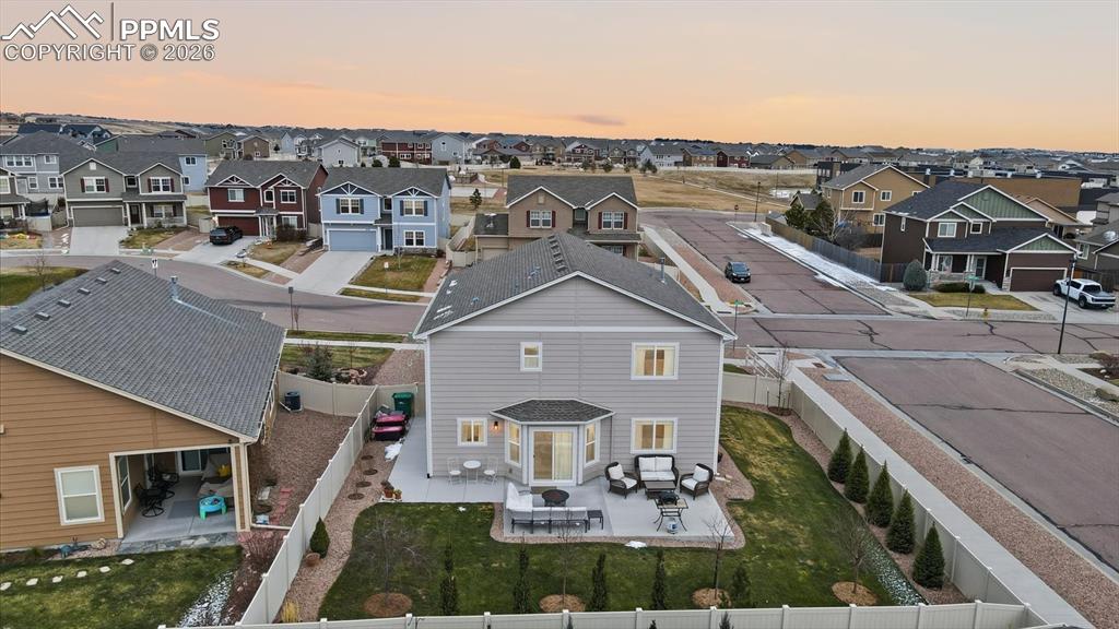 Large concrete patio with walkway on the side yard.