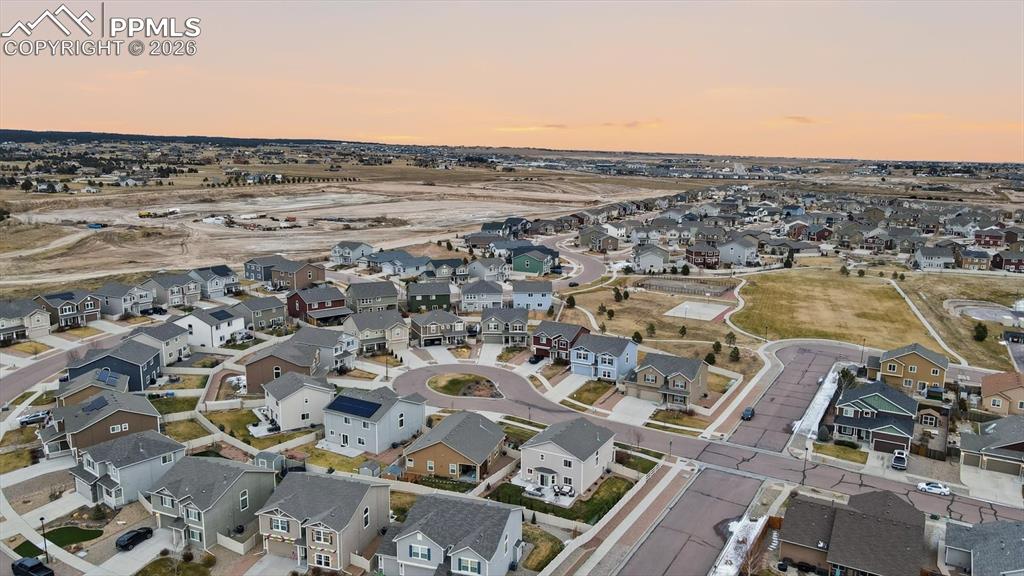Aerial view of home and neighborhood.