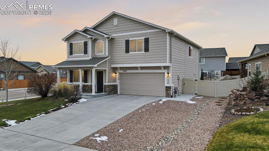 Rock side yard and concrete walkway to the backyard.