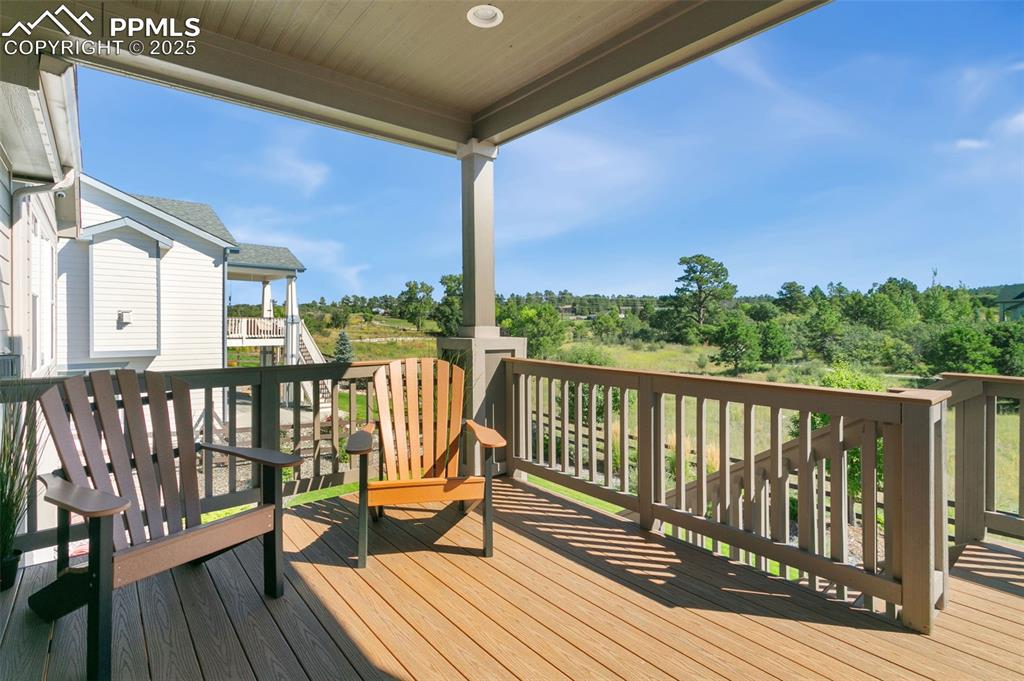 Deck with view of wooded area