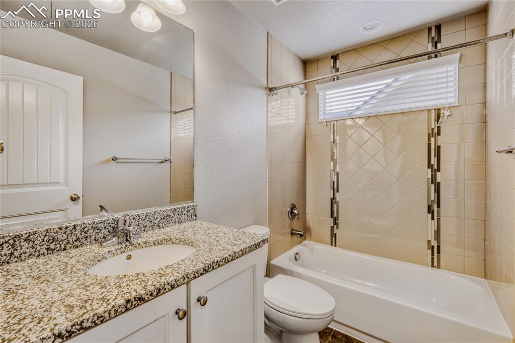 Full bathroom featuring vanity and shower / bath combination