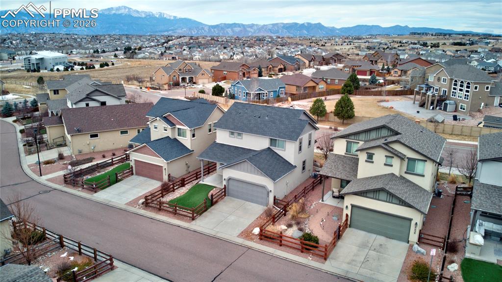 Aerial view of residential area with  mountains backdrop