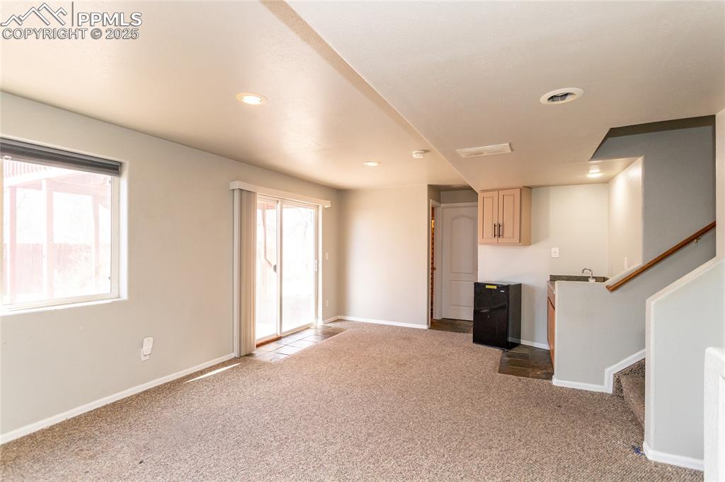 Basement family room walks out to covered patio