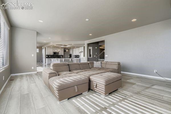 Living room featuring light wood-style floors and recessed lighting