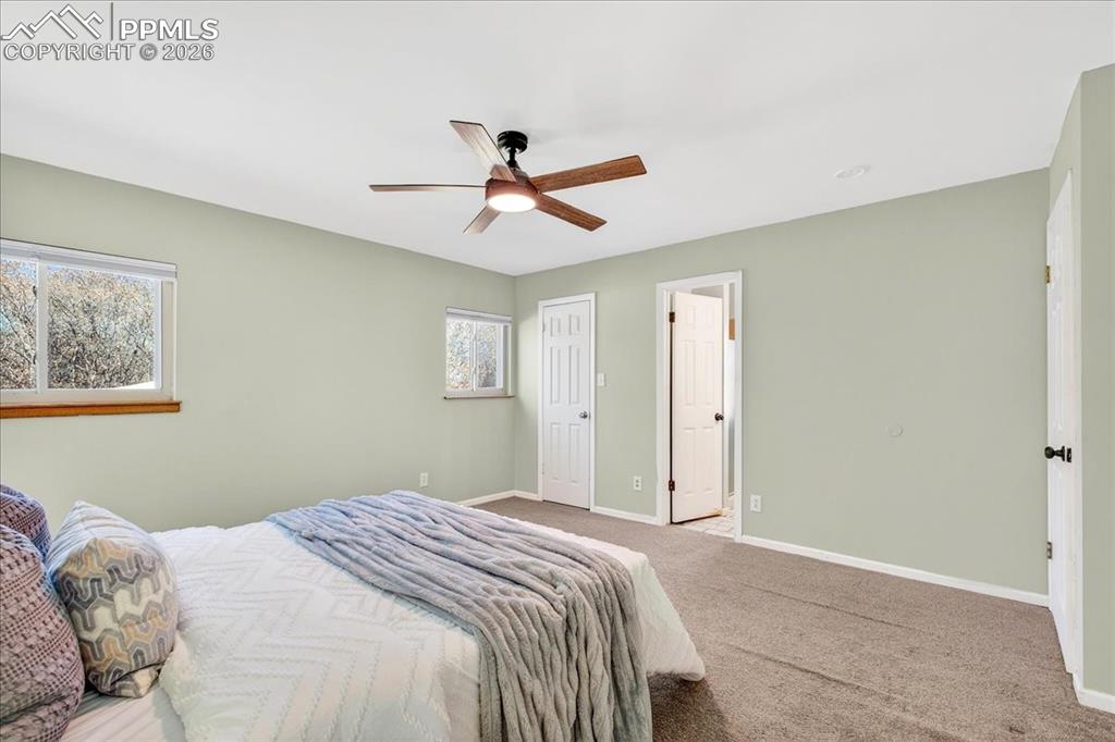 Bedroom featuring carpet flooring and a ceiling fan
