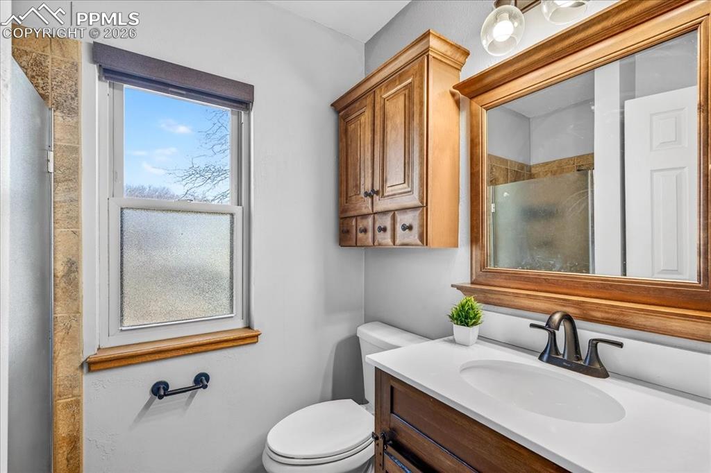 Bathroom with vanity and a shower stall