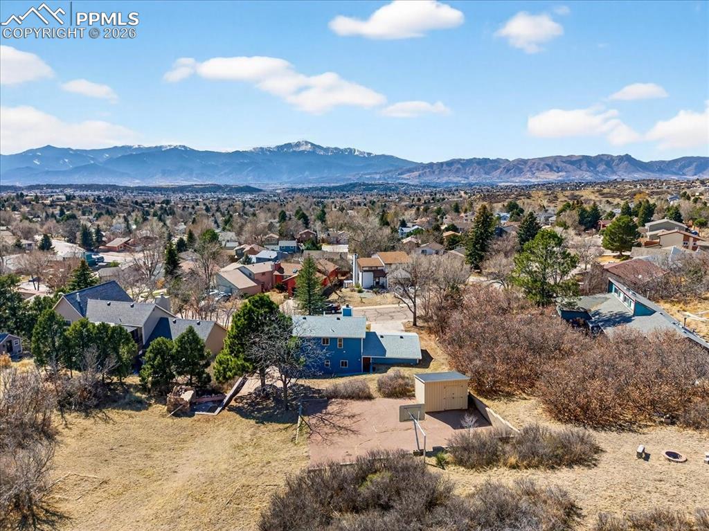 Aerial perspective of suburban area with a mountain backdrop