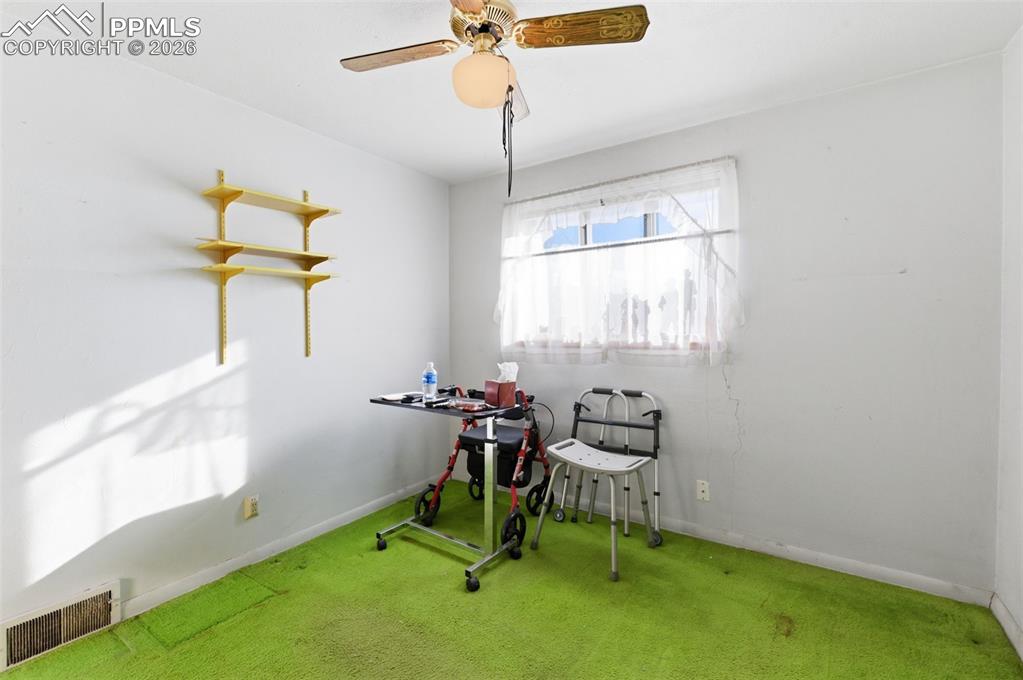 Playroom featuring carpet flooring and a ceiling fan