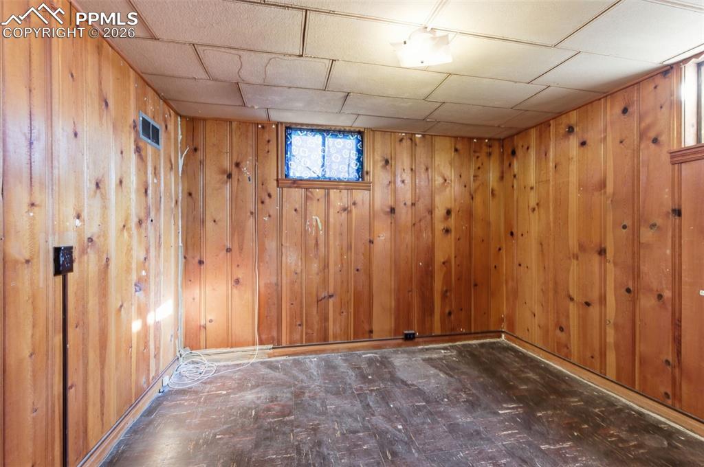 Below grade area featuring dark flooring