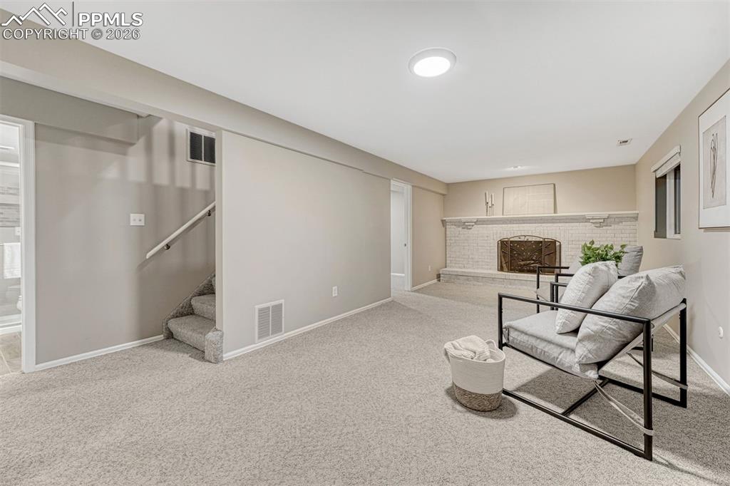 Expansive family room with wood burniing fireplace