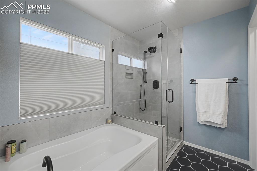 Tastefully remodeled primary bedroom 5 piece bathroom.