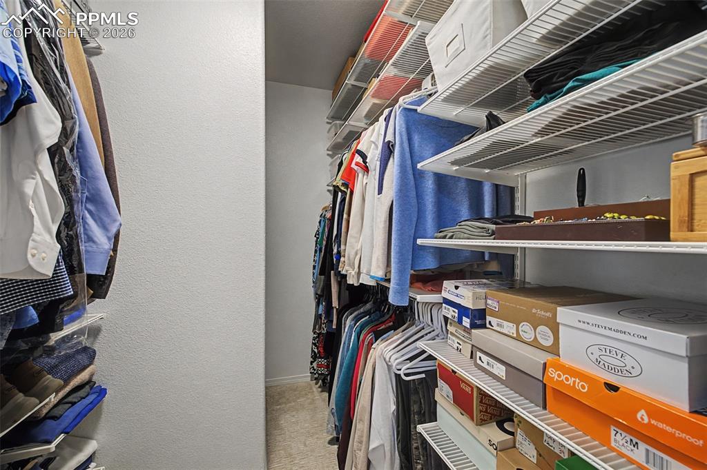 Primary bedroom walk in closet.