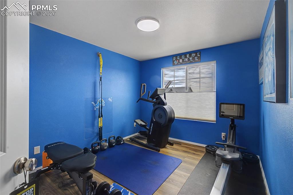 Upstairs additional bedroom being used as a workout area.