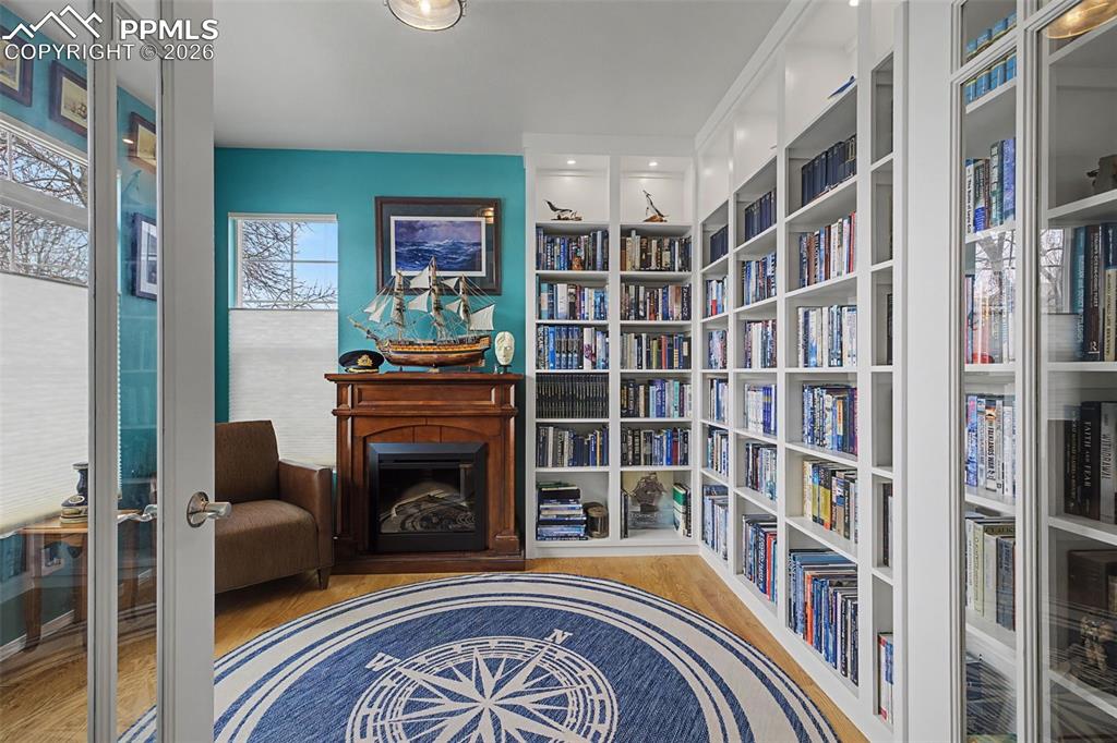 Main level dedicated office with built-ins and a fireplace that stays!