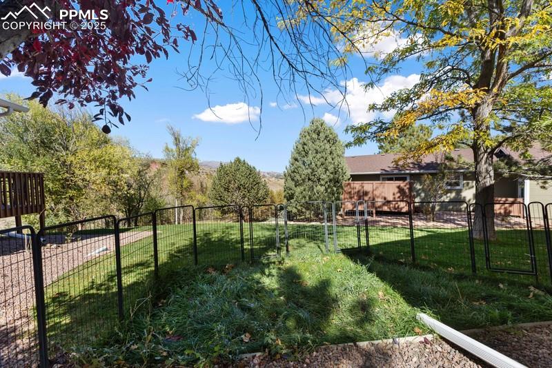 View of fenced backyard