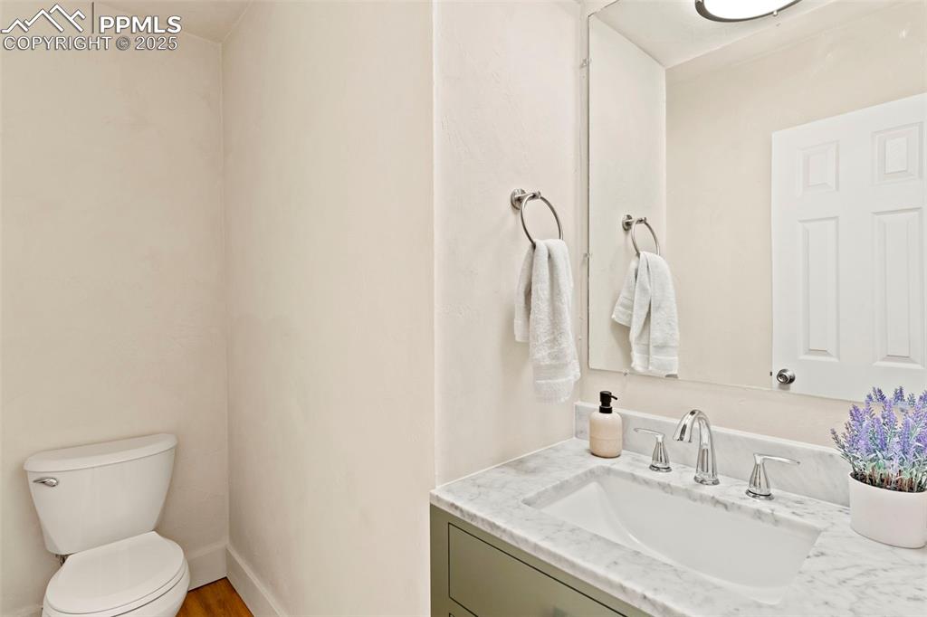 Updated bathroom on main level across from staircase