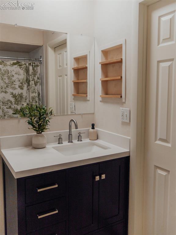 Built-in shelving in upper level bathroom