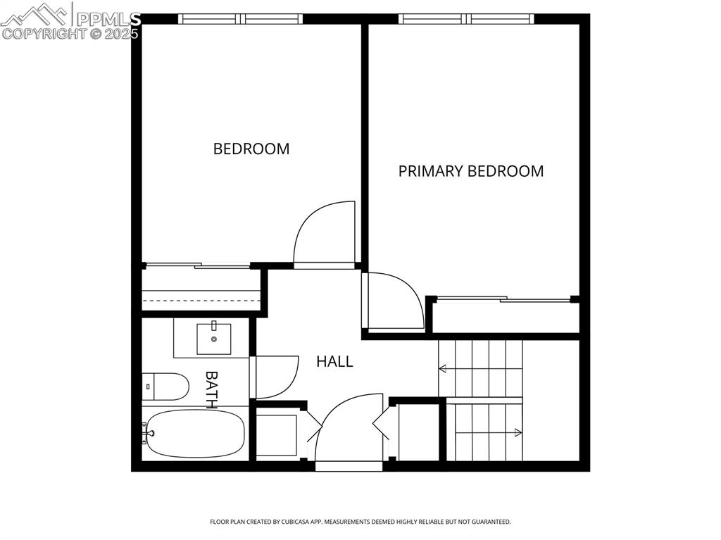 Upper level includes 2 bedrooms, full bathroom, and additional exterior entrance by closets.