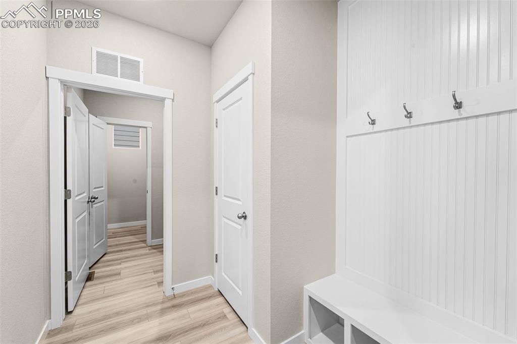 Mud room located at garage door entry