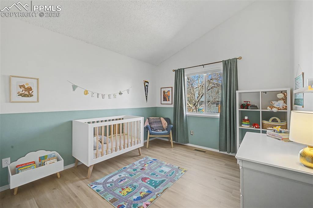 Bedroom 2 on upper level. Window faces the backyard