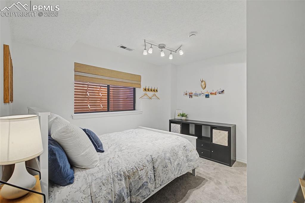 Bedroom 4 with attached 3/4 bath in the basement.