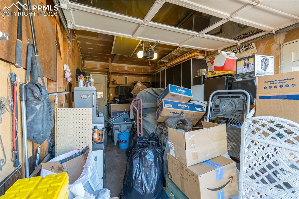 garage with workbench and cabinetry