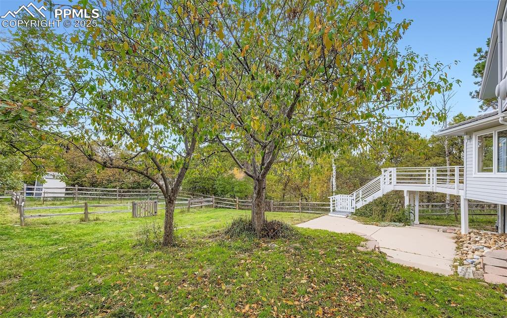 Fenced backyard with stairway