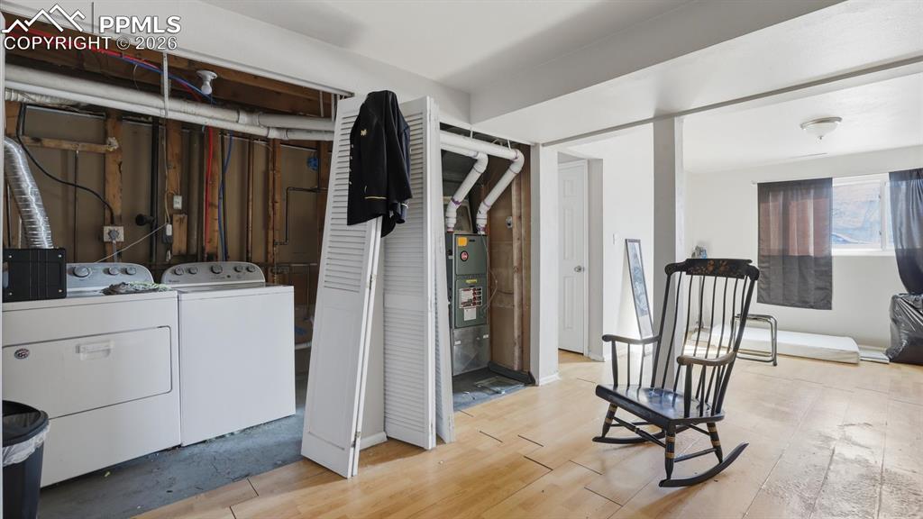 Laundry Area with washer and dryer that stay.