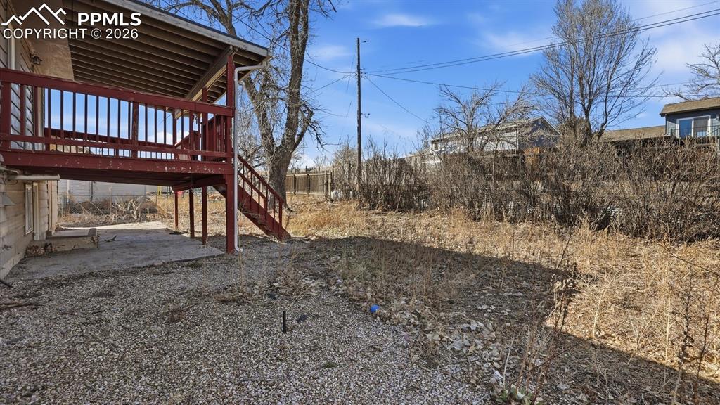 Spacious fenced backyard ready for your dreams and imagination.