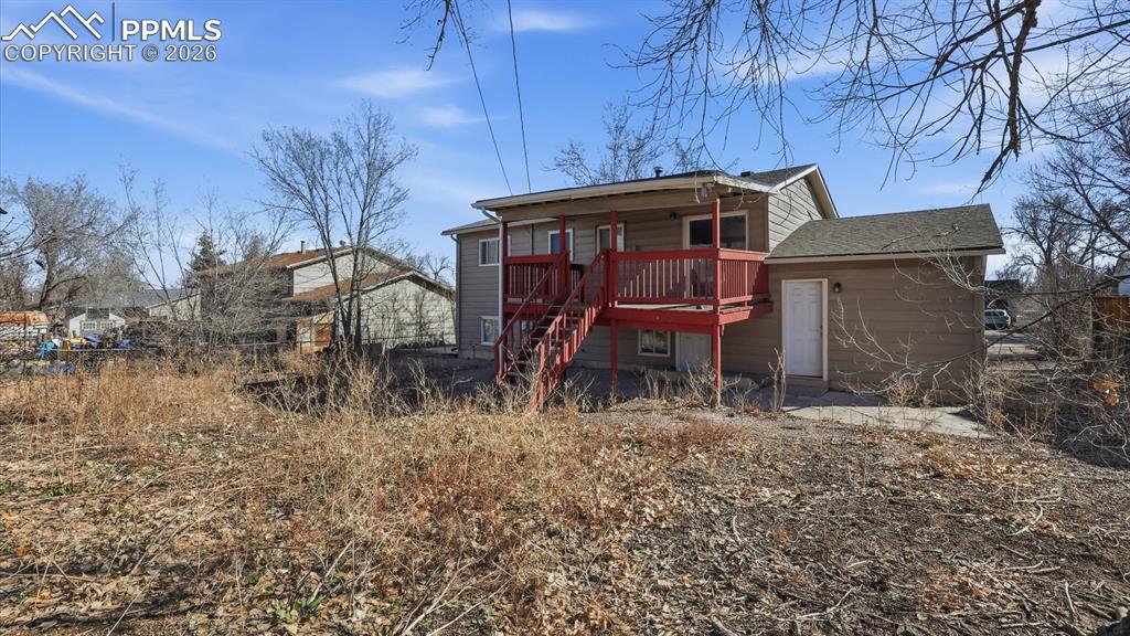 Rear view of home and backyard.