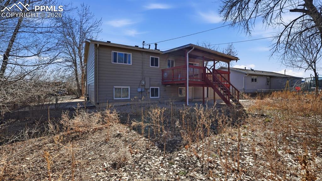 Rear view of home and backyard.