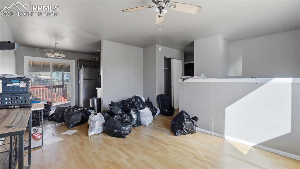 The Living Room flows seamlessly into the Dining Area with slider to a covered wood deck.