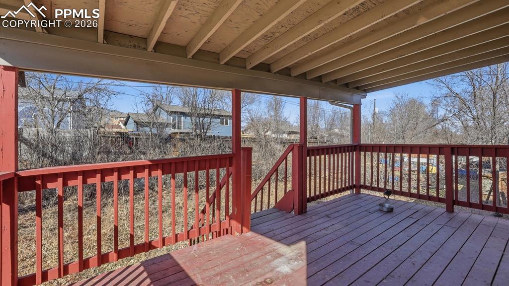Covered deck located off the Dining Area for outdoor dining and relaxation.