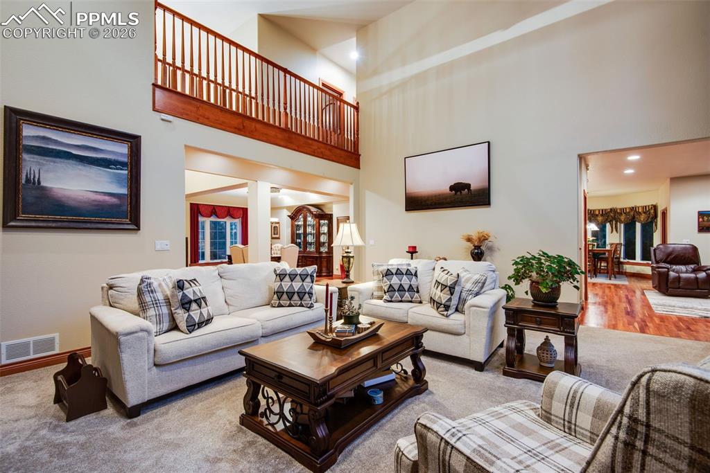 Living room from another view looking up at the catwalk hall to the upstairs bedrooms