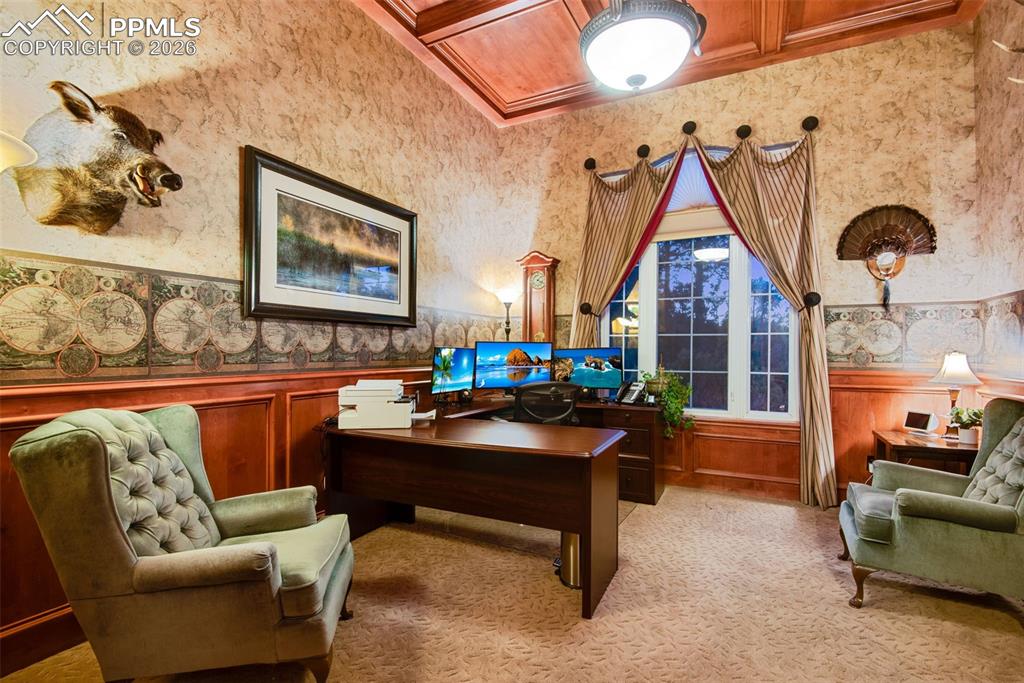 Office with coffered ceilings located on the main level