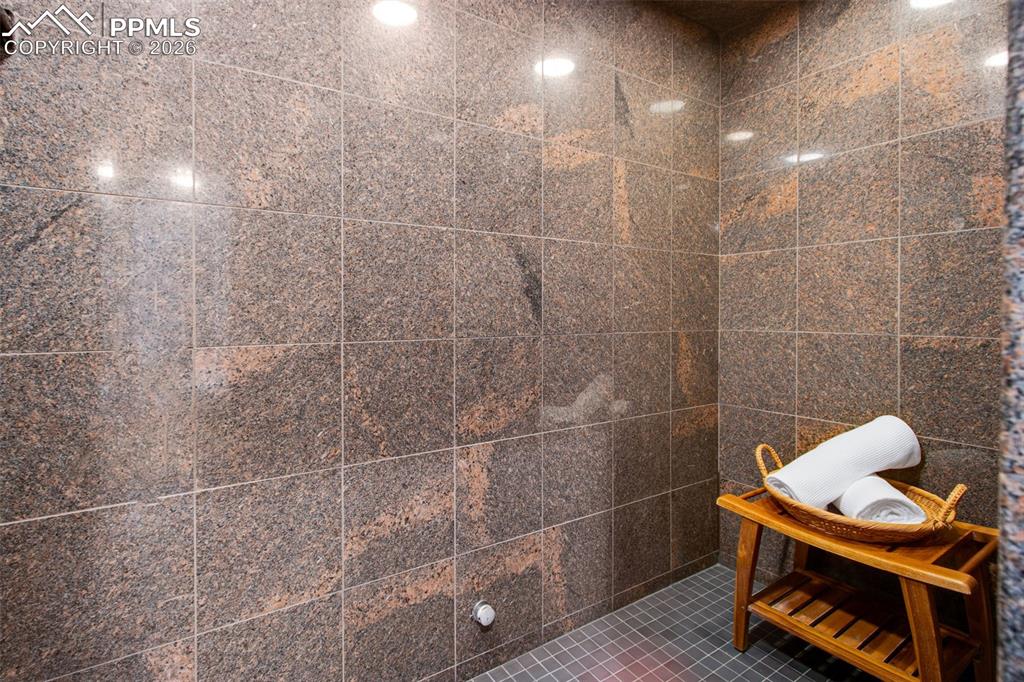 Steam shower in the bathroom attached to the bonus room located in the basement level