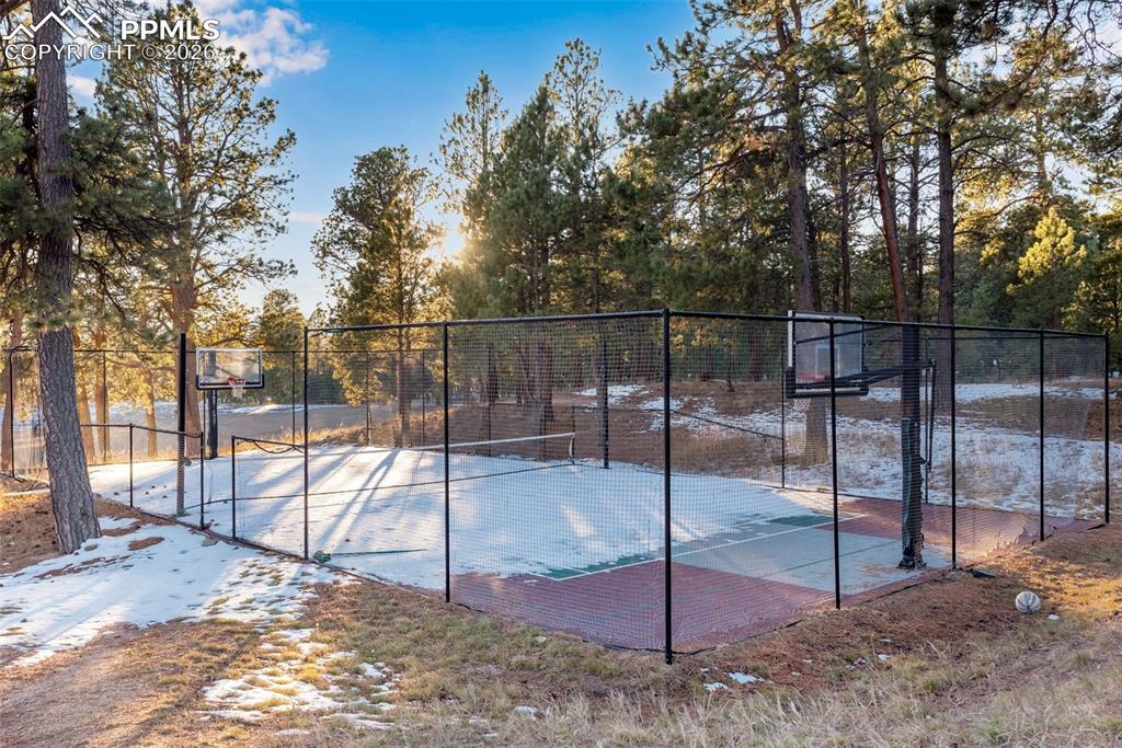 Community basketball/tennis/pickleball courts located next to the club house