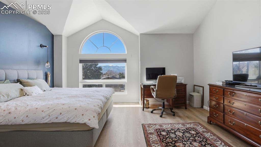 The upper level Primary Bedroom has a vaulted ceiling, LVP flooring, accent wall, space for a sitting or office area, and an adjoining 5pc Bathroom.