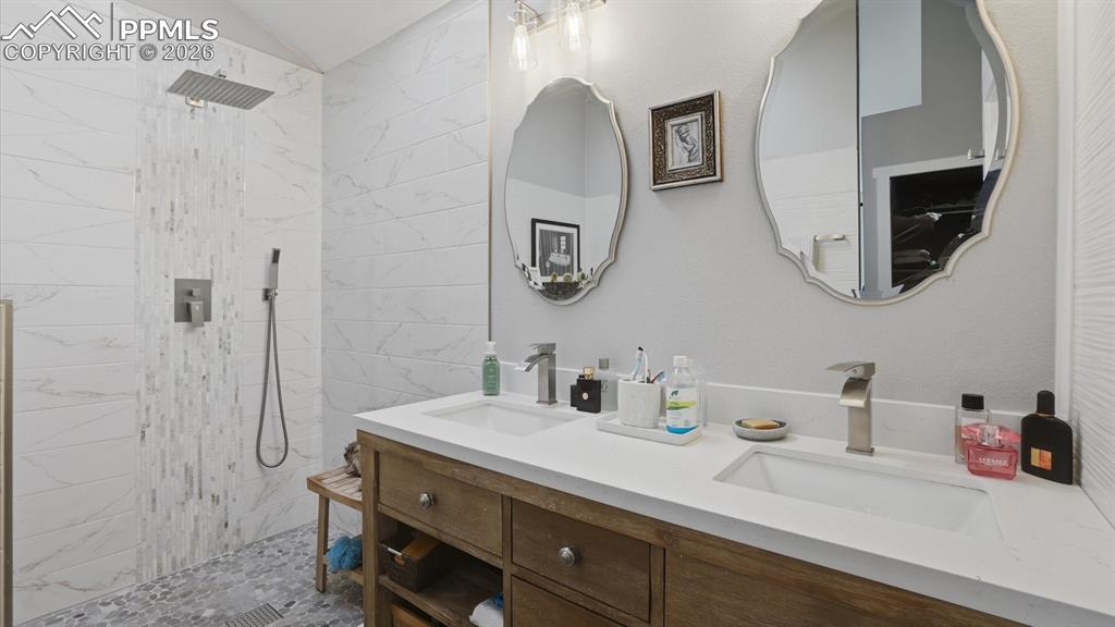 Dual sink vanity and walk in shower in the Primary Bathroom.