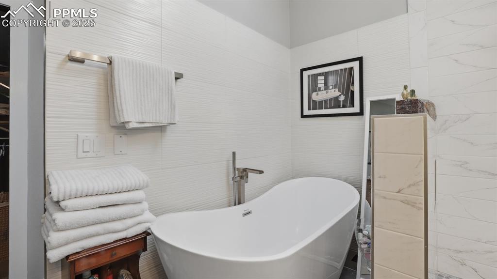Relax in the Primary Bathroom soaking tub after a long hard day.