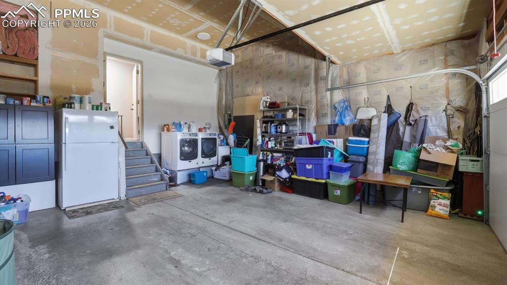 2-car attached garage with door opener and storage.