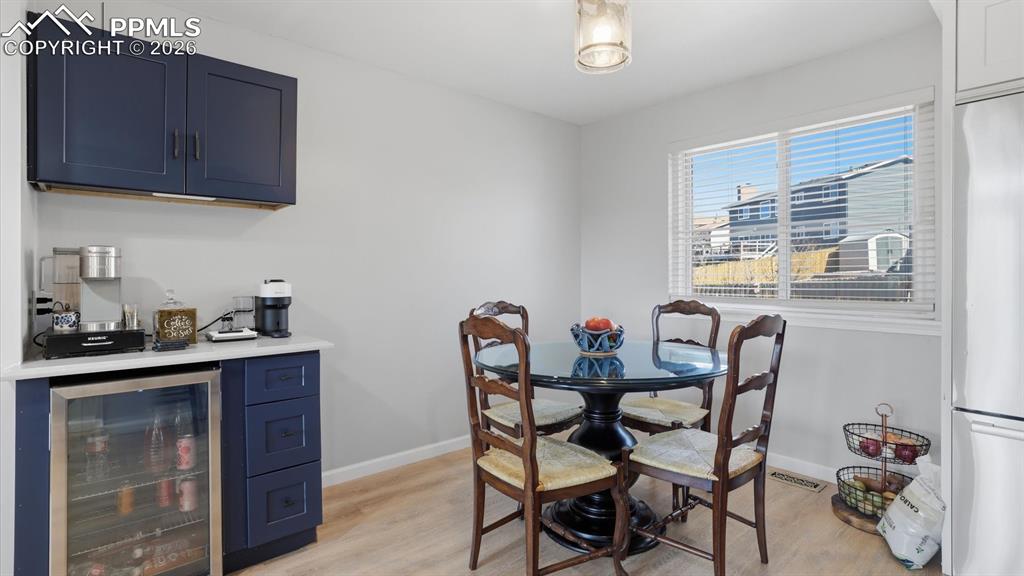 Dining Area located just off the Kitchen with dry bar and beverage refrigerator.