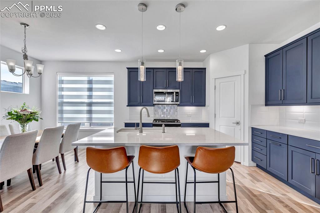 Kitchen - Maple cabinets, LVP floors, quartz countertops, recessed lighting, 9+ foot ceilings