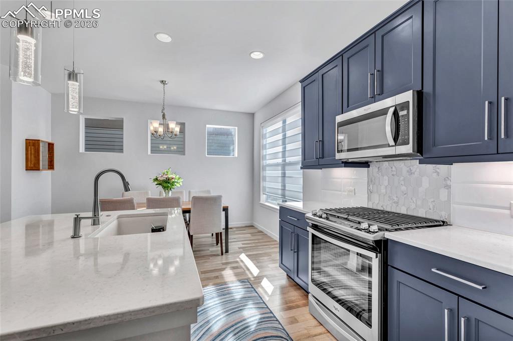 Kitchen - Maple cabinets, LVP floors, quartz countertops, recessed lighting, 9+ foot ceilings
