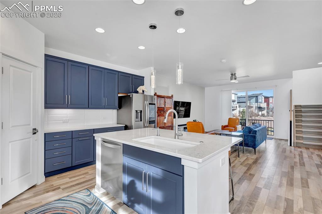 Kitchen - Maple cabinets, LVP floors, quartz countertops, recessed lighting, 9+ foot ceilings
