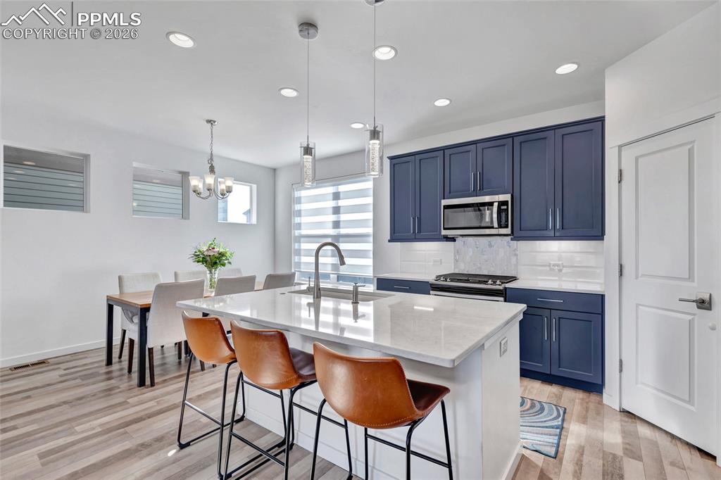 Kitchen - Maple cabinets, LVP floors, quartz countertops, recessed lighting, 9+ foot ceilings