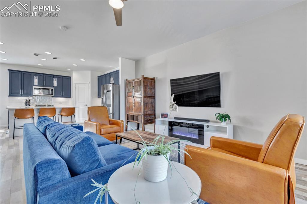 Living room - walkout to deck, recessed lighting, custom wiring for electronics, smart thermostat, custom window treatments