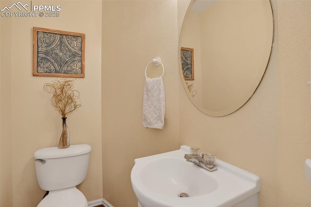 Inside, the bright and welcoming layout offers a cozy gas fireplace, an updated kitchen with new quartz countertops and sink, and a convenient main-level half bath.